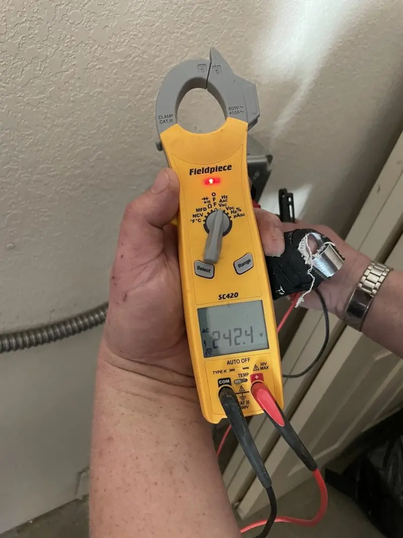 Voltage testing with clamp meter during Outlet Installation in Tomball